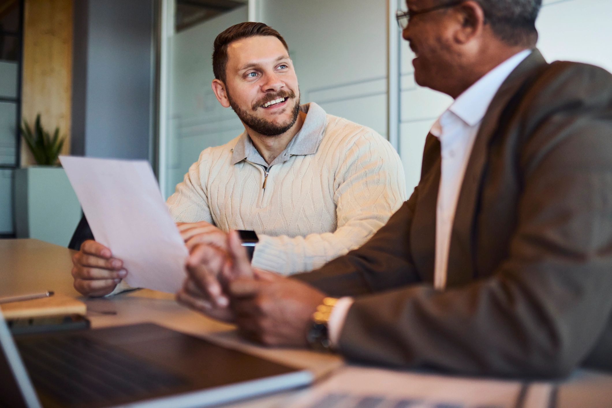 Business consultant reviewing documents with a client